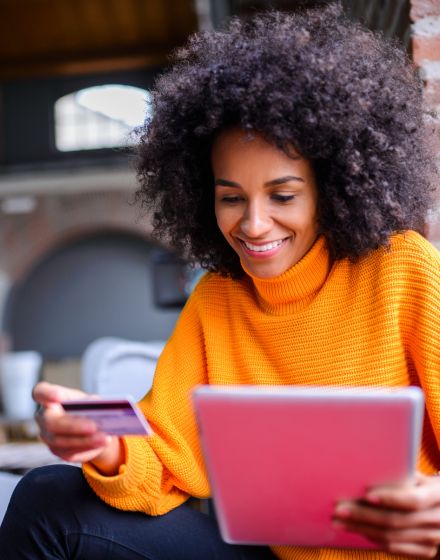 woman with tablet and credit card