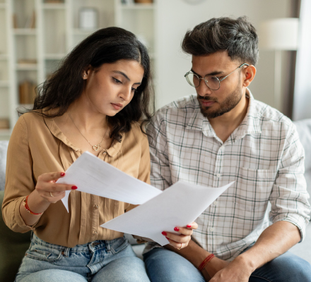 young couple looking at mortgage information