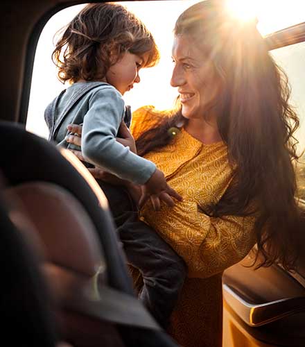 Mom and child getting out of car.